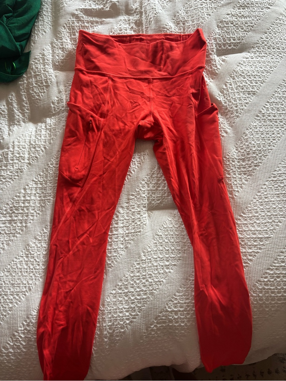 Athleta orange legging with side pockets size small barely worn